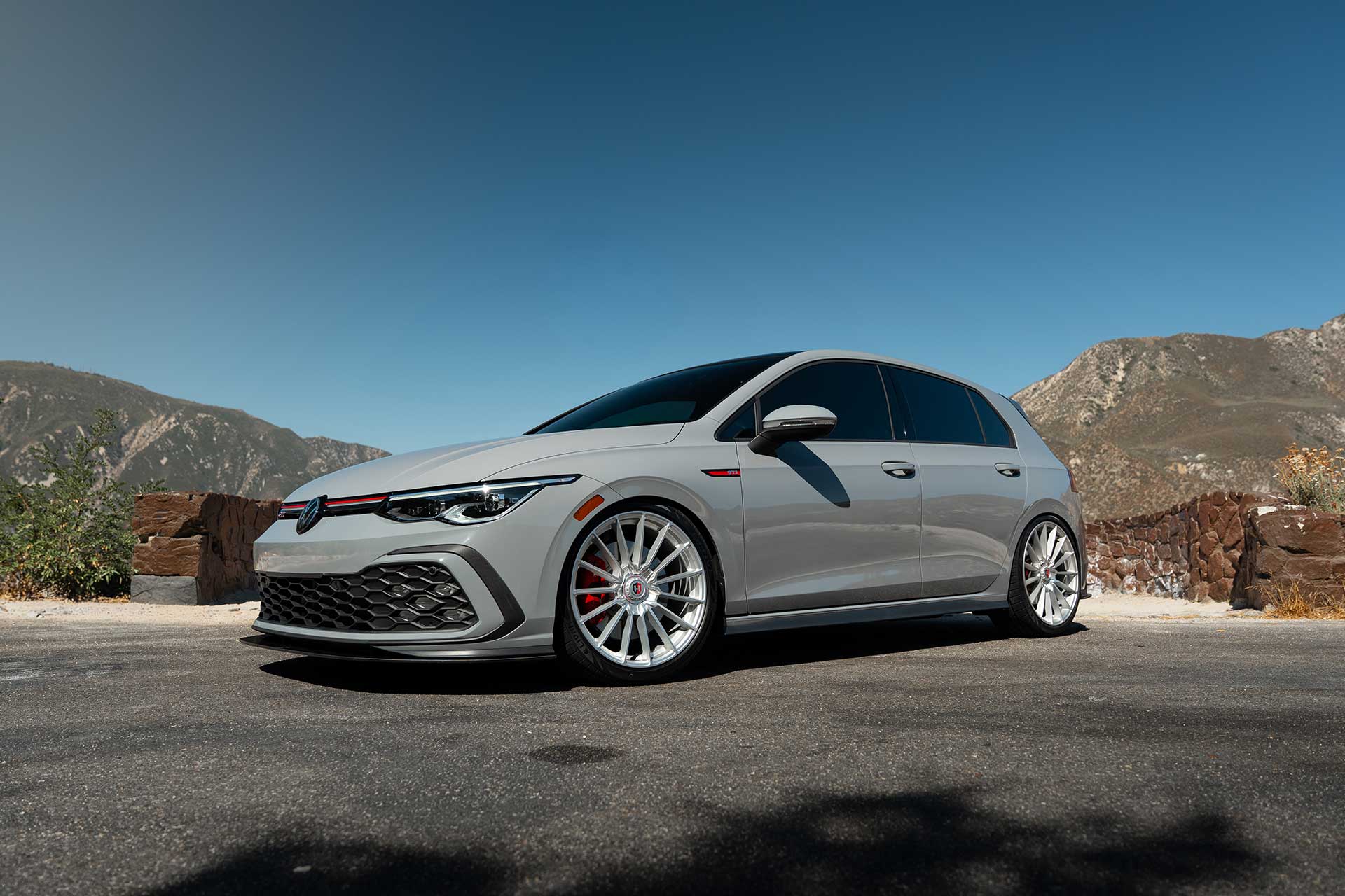 moonstone gray mk8 volkswagen gti with center lock style cff75 flow forged wheels on canyon road