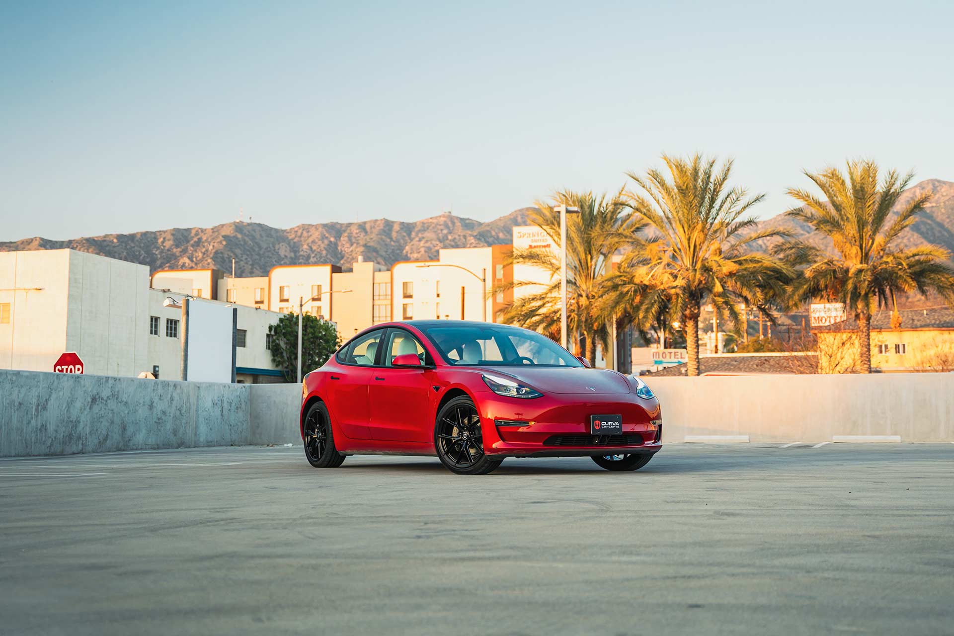 red tesla model 3 with gloss black cff70 flow forged wheels
