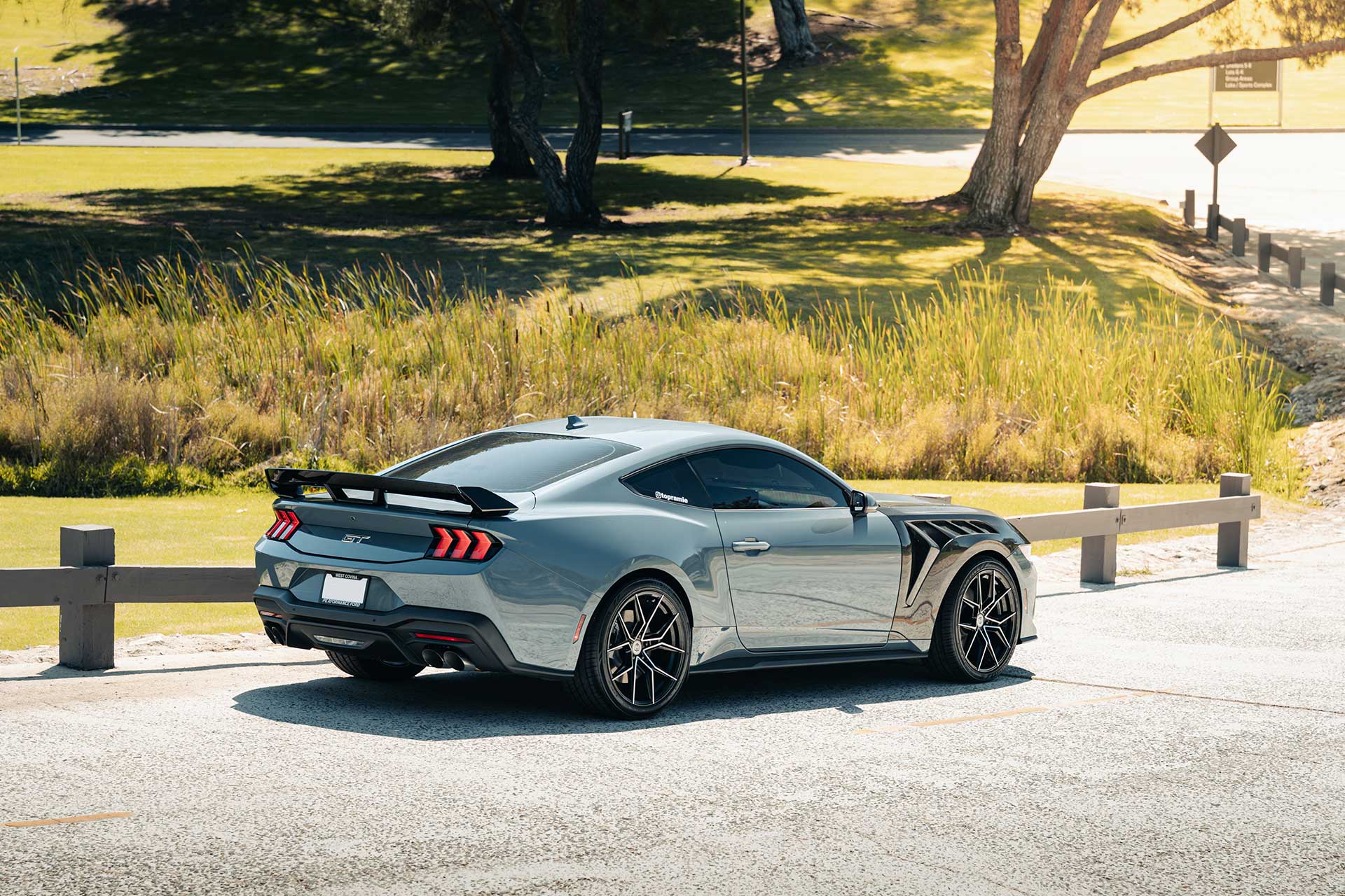 vapor blue metallic ford mustang gt with gloss black machined cff43 flow forged wheels in lush green park