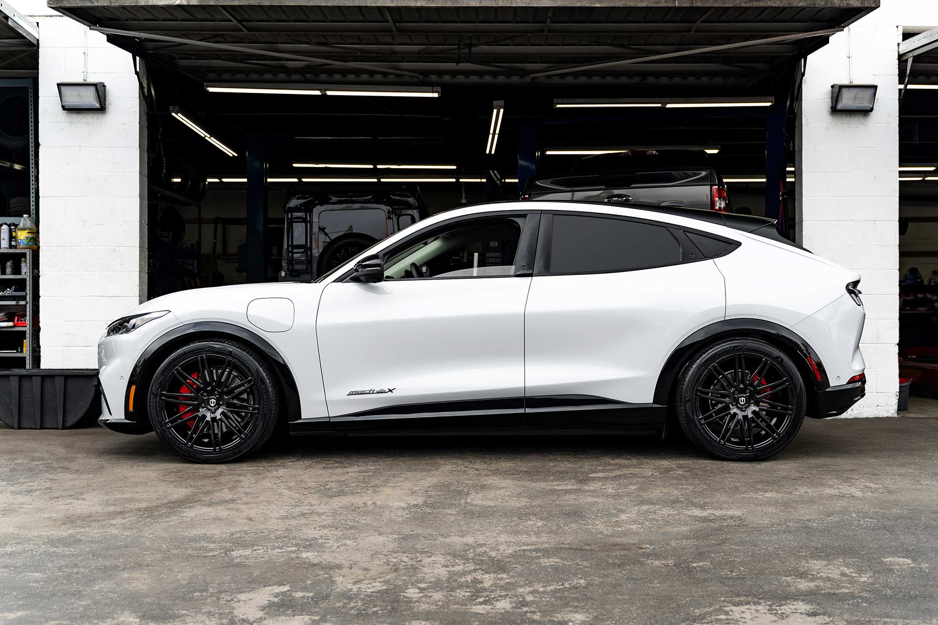 white ford mustang mach-e with gloss black c48 curva concepts wheels